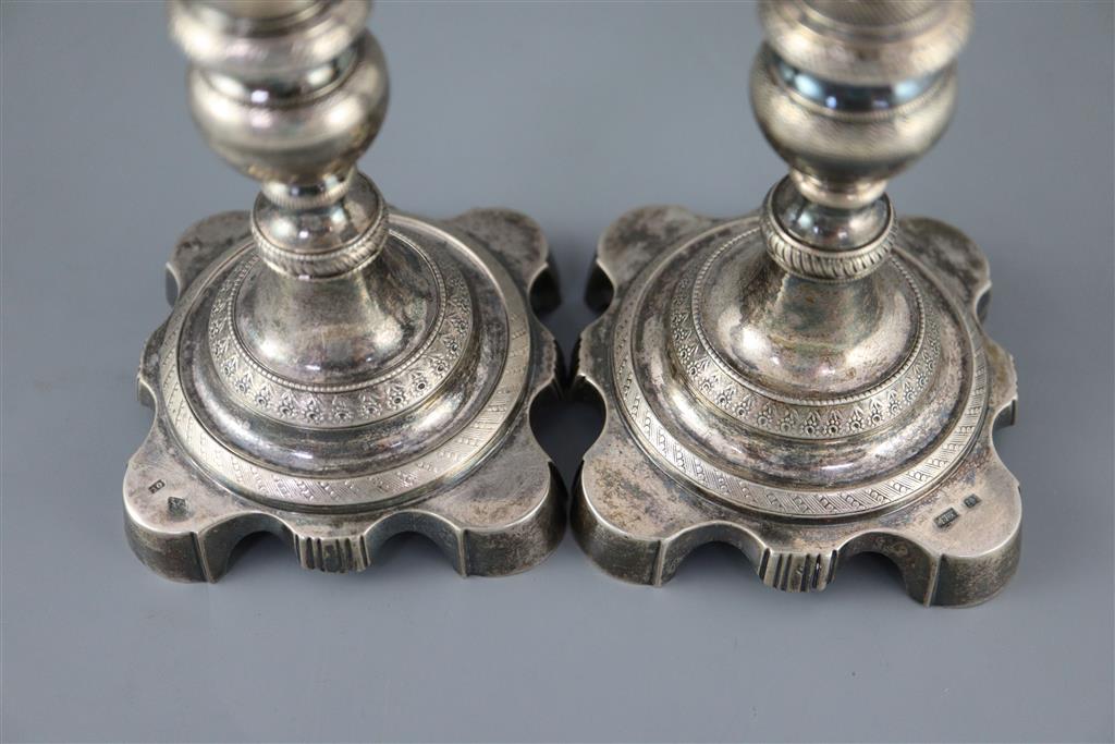 Two 19th century Brazilian? cast silver candlesticks,